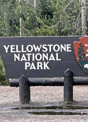 Yellowstone National Park entrance sign in West Yellowstone, Montana